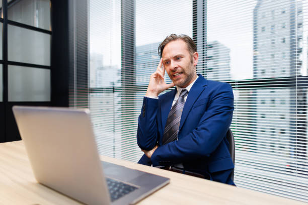 istock Businessman contemplating at work 1557243363