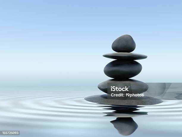Black Zen Stones In Shallow Water Stock Photo - Download Image Now - Zen-like, Balance, Rock - Object