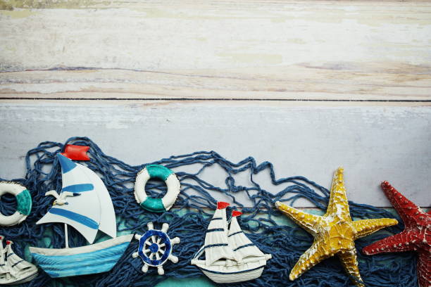 istock Nautical and summer background top view on wooden background 1557260998