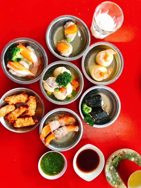 istock Variety of dim sum baskets, top view 1557261193