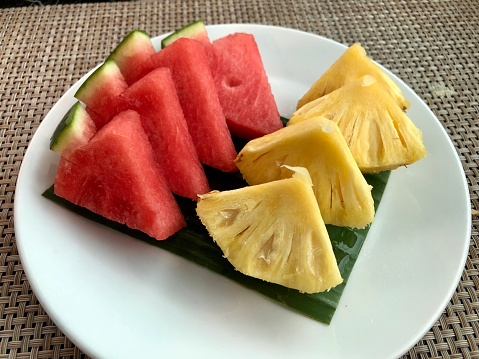 Sliced red watermelon and pineapple