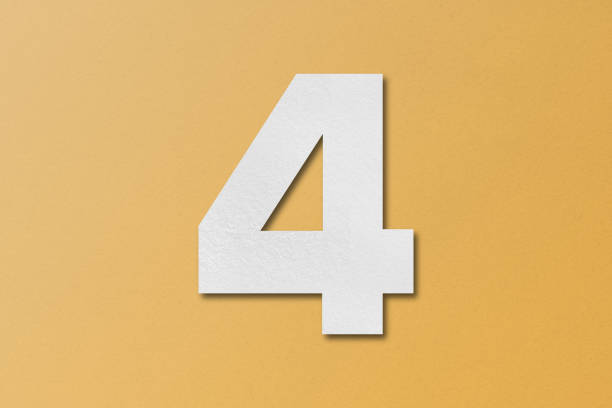 istock White paper type paper alphabet number 4 isolated on orange background. 1557266637