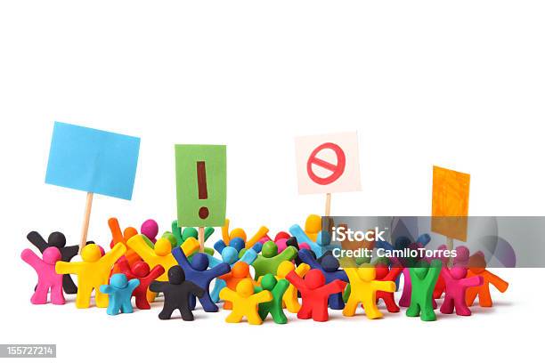 Dolls Holding Signs Demonstrating A Protest Stock Photo - Download Image Now - Community, Protest, Riot