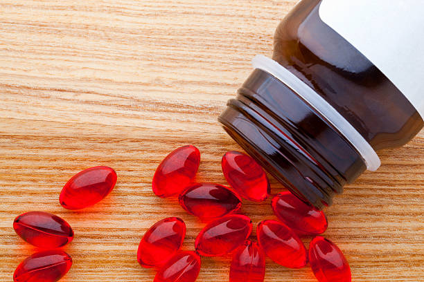 istock Pot of red pills 155727564