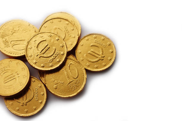 istock Golden Euro coins  filled with chocolate  on white 1557276601