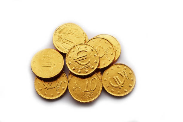 istock Golden Euro coins  filled with chocolate  on white 1557276861