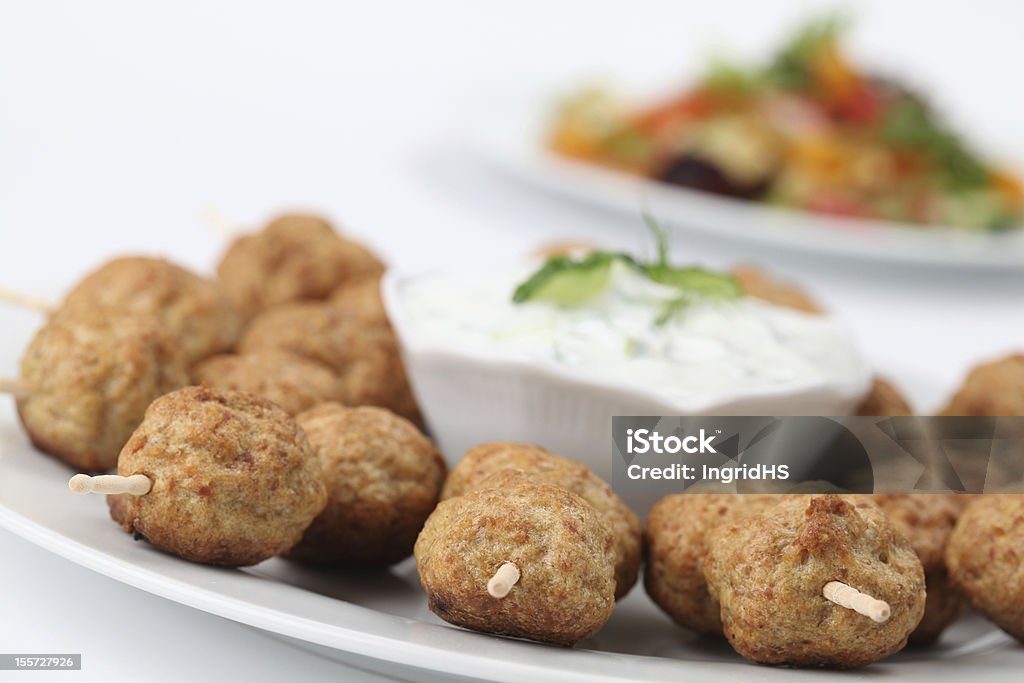 Kebab with tzatziki Roast meatballs on skewers and tzatziki dip. Shallow DOF Appetizer Stock Photo