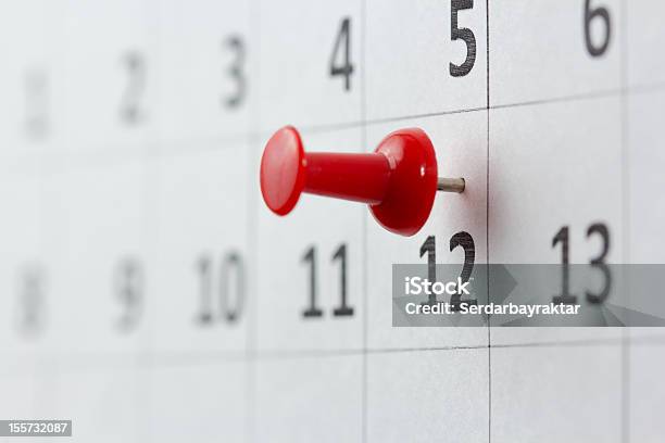 A Red Pin On The 12th Of The Month Stock Photo - Download Image Now - Calendar, Straight Pin, Number 12