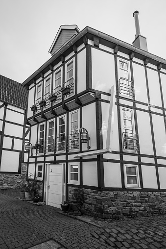 Hattingen, Germany - April 11, 2022: Hattingen's Old Town (Altstadt), a traditional German architectural district with half-timbered houses. Black and white photography.