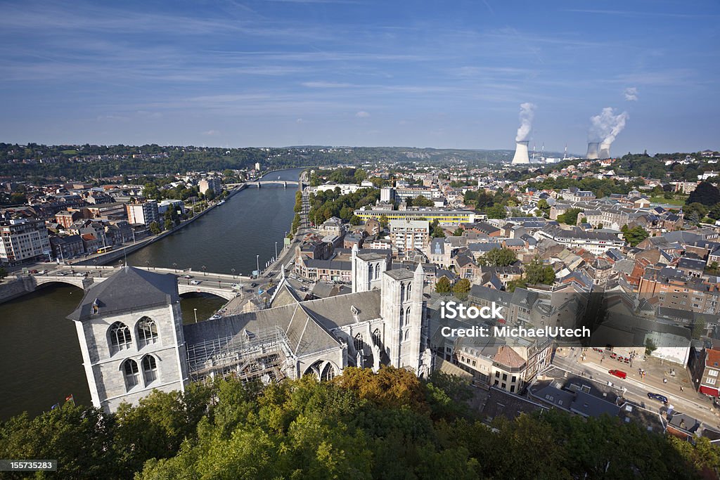 Huy, Belgium View over cathedral and city of Huy in Belgium at Meuse River to a distant nuclear power station.^ Belgium Stock Photo