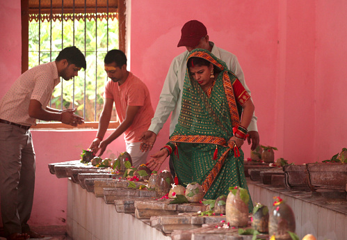 Indian devotees worship of God Shiva during the holy month of Shrawan at a temple known as Shiv Kutchehry in Prayagraj, India.  During the month of Shrawan people offer Holy water of river Ganges and milk to the God Shiva .