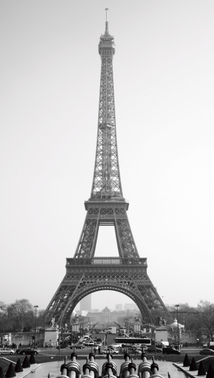 Paris, France - April 12, 2012: The Eiffel Tower on a bright sunny day shot low down from the grass of the Parc du Champs-de-Mars