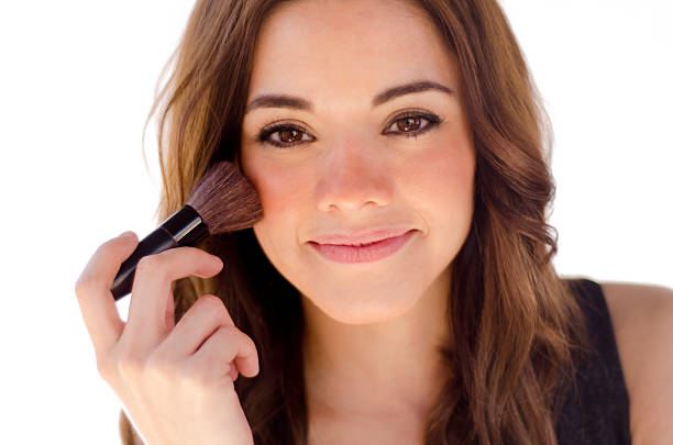 istock Beautiful woman putting some makeup on 155737866