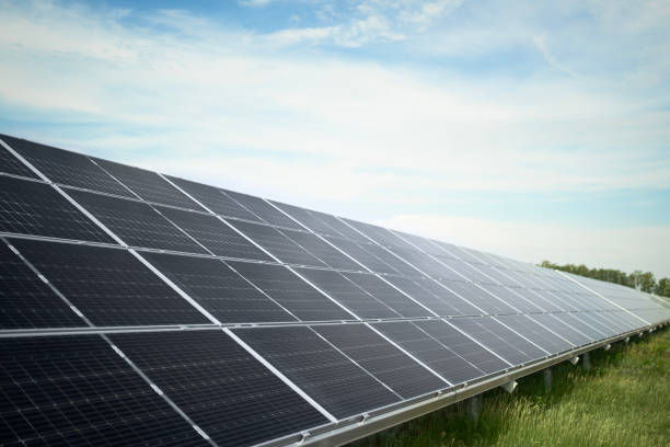 istock Solar panel, photovoltaic, alternative electricity source - concept of sustainable resources. Landscape of solar panels at solar power plant 1557402633