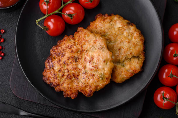 istock Delicious fresh fried minced chicken meat cutlets with salt, spices and herbs 1557415218