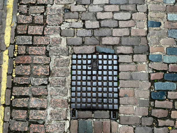 Drain cover on a cobbled street in Norwich