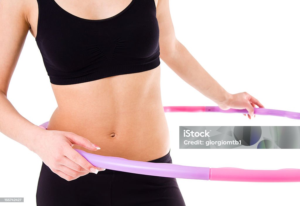 Woman holding hula hoop Young attractive woman holding hula hoop Activity Stock Photo