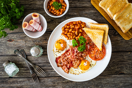 Sunny side up Eggs with Haggis,Blood Pudding, Sausage, Bacon, Beans, Mushrooms, Toast and Tomatoes-Photographed on Hasselblad H3D-39mb Camera
