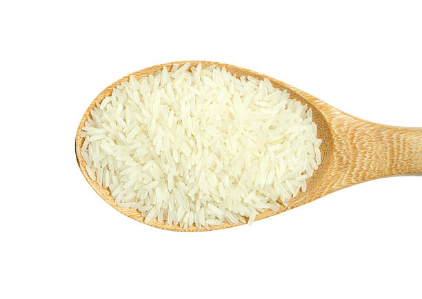 istock rice grain in wooden spoon isolated on white 155743624