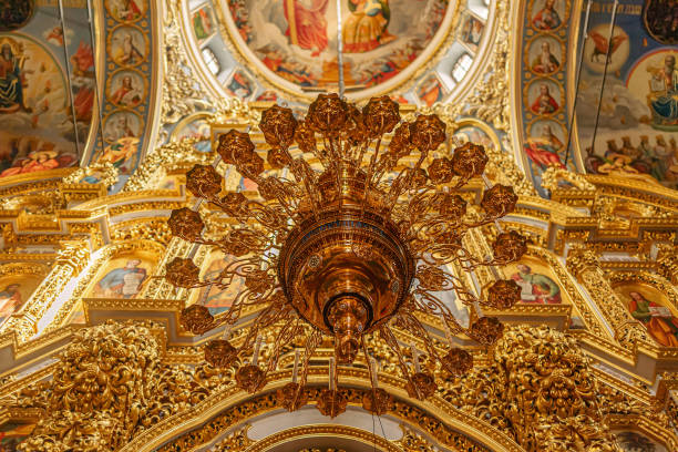 View of the decorative ceiling surrounding the gold chandelier at Uspenski Cathedral in Helsinki, Finland.