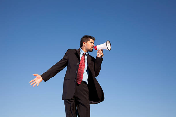 istock Businessman speaking with a megaphone 155745479