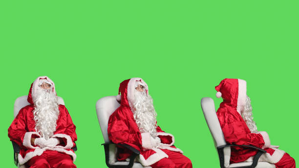 istock Santa claus character on chair 1557459635