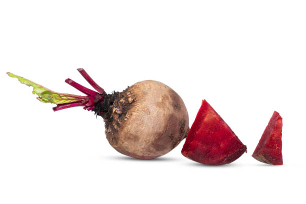 istock Closeup beetroot (beet root) and cut in half sliced isolated on white background. 1557460711