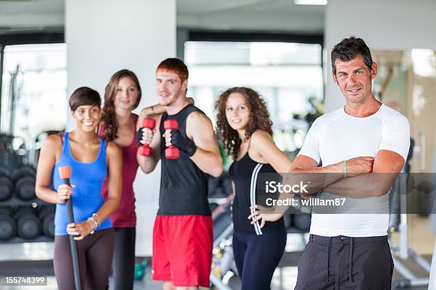 Group Of People At Gym With Instructor Stock Photo - Download Image Now - Adult, Group Of People, Gym