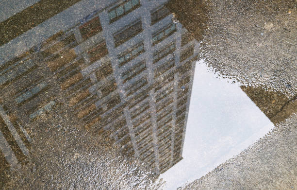 Free Stock Photo of Urban Buildings Reflected in Water Puddle ...