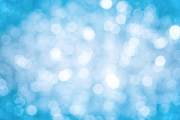 istock Blurred blue sparkles background with darker corners and bright center 155750505