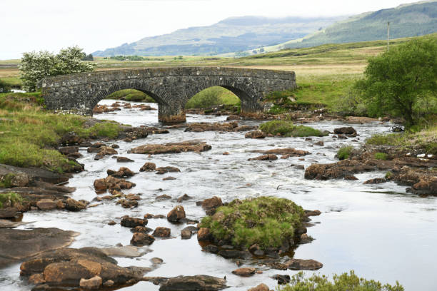 istock Landscape on the isle of Mull (Scotland) with double-arched bridge 1557511320