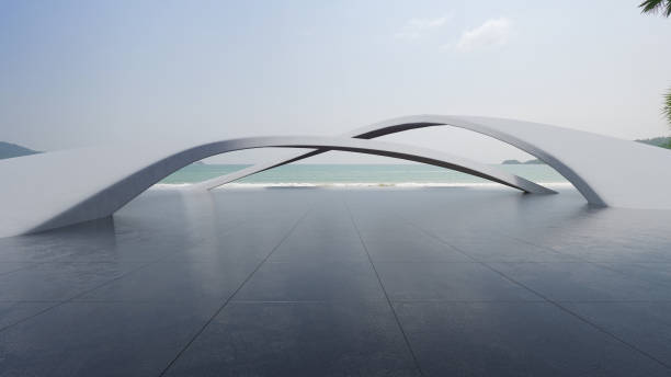 istock Abstract architecture design of modern building. Empty parking area concrete floor with beach and blue sky sea view. 1557529163