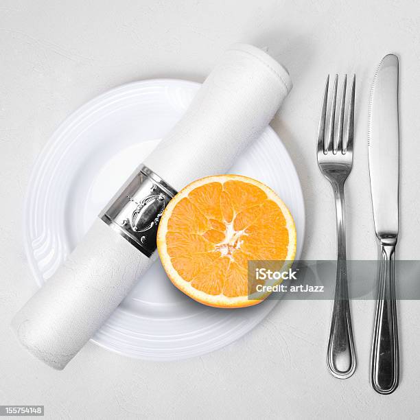 Orange On Plate With Napkin Fork And Knife Stock Photo - Download Image Now - Citrus Fruit, Close-up, Color Image
