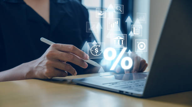 istock Businessman using laptop with percent sign. 1557554938