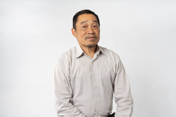 istock Portrait Asian Mature Man Showing Expression and Emotion on Face in studio 1557575103