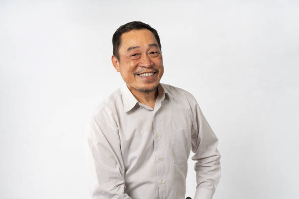 istock Portrait Asian Mature Man Showing Expression and Emotion on Face in studio 1557575110