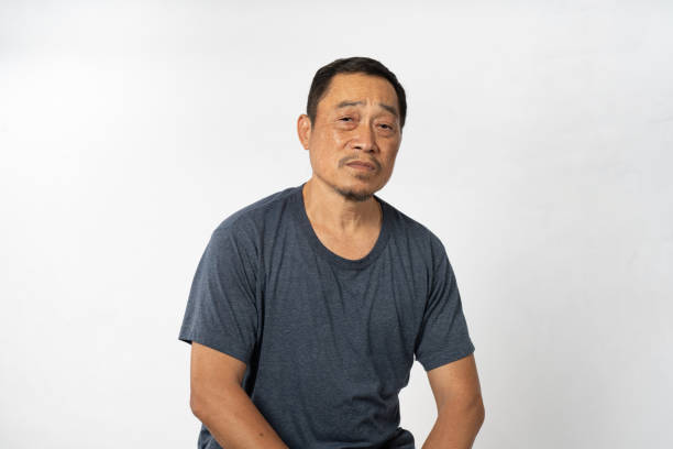 istock Portrait Asian Mature Man Showing Expression and Emotion on Face in studio 1557575132