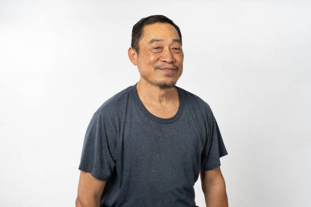 istock Portrait Asian Mature Man Showing Expression and Emotion on Face in studio 1557575136