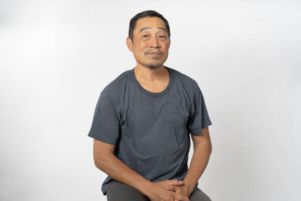 istock Portrait Asian Mature Man Showing Expression and Emotion on Face in studio 1557575576