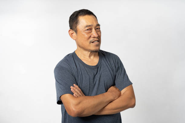 istock Portrait Asian Mature Man Showing Expression and Emotion on Face in studio 1557575646