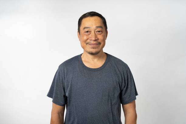 istock Portrait Asian Mature Man Showing Expression and Emotion on Face in studio 1557576725