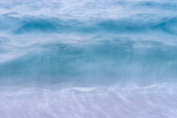 istock A seascape abstract wave background, panning motion blur with a long exposure, pastel colors in a vintage and retro style. 1557577256