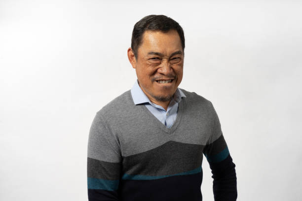 istock Portrait Asian Mature Man Showing Expression and Emotion on Face in studio 1557585221