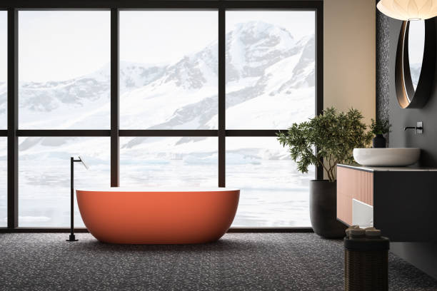 istock Modern minimalist bathroom interior with orange bathtub 1557604144