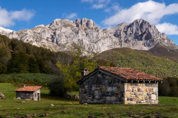 Typical stone barn of Picos de Europa to spend the winter with the livestock in Vegabaño. Leon, Spain