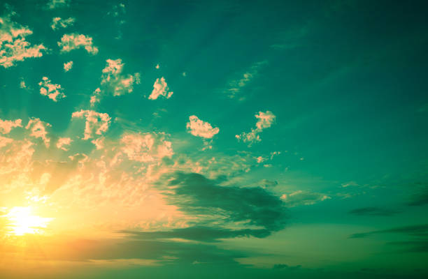 Colorful cloudy sky at sunset. Green yellow gradient color. Sky texture. Abstract nature background