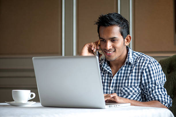 istock Attractive Indian Man Talking on the phone 155765261
