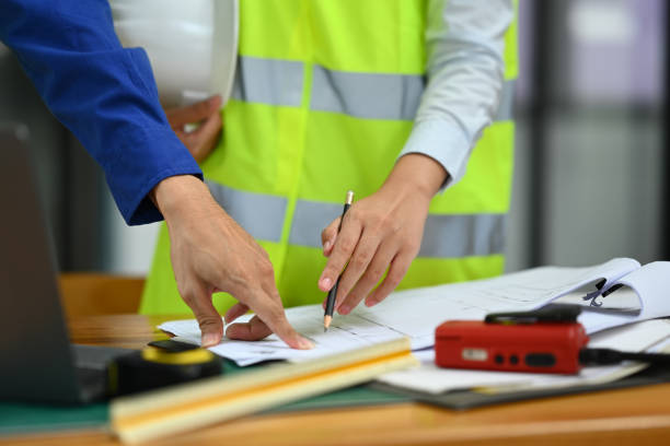 istock Cropped image of architects team working on project ,collaborating, planning working together in meeting room. 1557660213