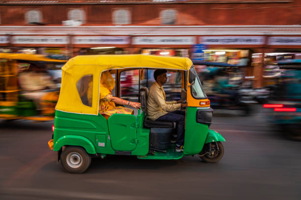 istock Indian man drives auto rickshaw (tuk-tuk), India 1557667987