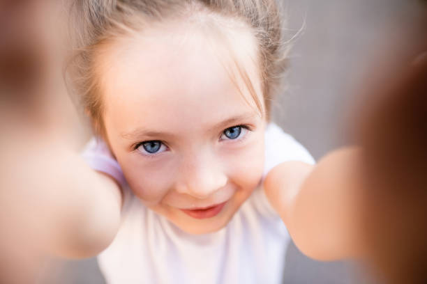 istock Funny child having fun outdoor 1557677914